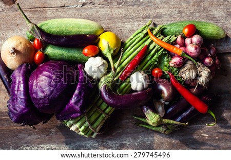 Farm market photo with different vegetables and greens. Organic products and healthy lifestyle photography. Fresh food on the wooden background.