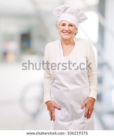 portrait of a cook senior woman smiling indoor