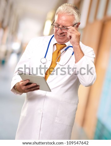 Portrait Of A Male Doctor Holding A Tab, Indoor