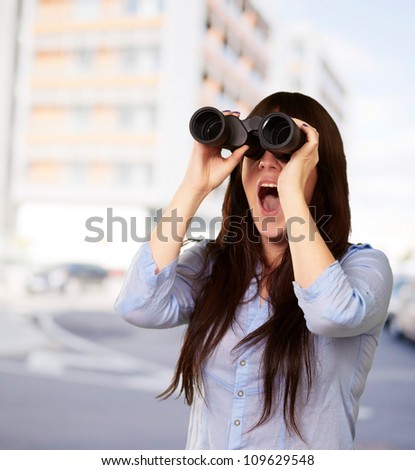Portrait Of A Young Woman Looking Through Binoculars, Outdoor