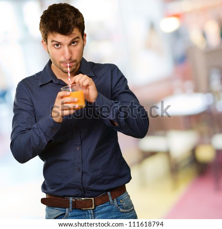 Young Man Drinking Juice, Indoor