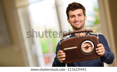Portrait Of Man Holding Radio, Indoor