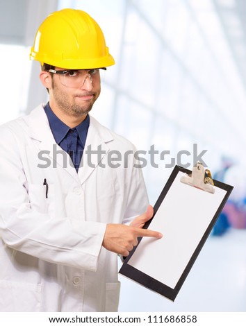 Technician Holding Writing Pad, Indoor