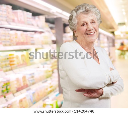 Portrait Of Happy Senior Woman In Supermarket
