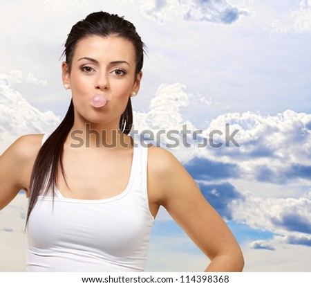 Female Blowing Bubble Gum, Outdoor