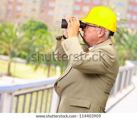Senior Architect Looking Through Binoculars, Outdoor