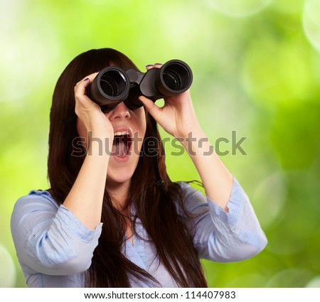 Portrait Of A Young Woman Looking Through Binoculars, Outdoor