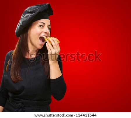 Portrait Of A Hungry Woman On Red Background