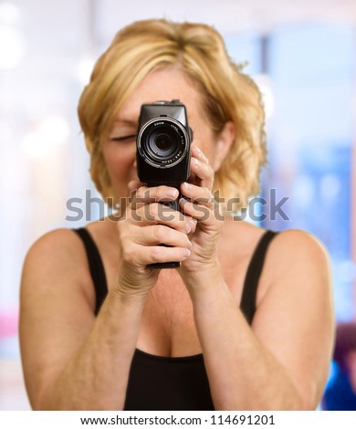 Woman Looking Through An Camera, Indoor