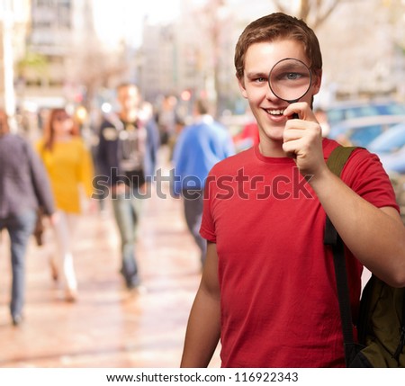 Portrait Of A Student Looking Through Magnifying Glass, Outdoor