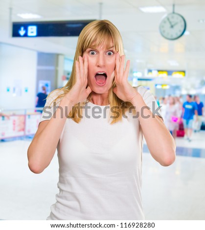 Portrait Of Shocked Woman waiting at the airport