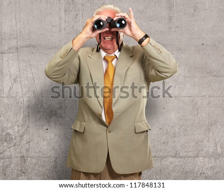 Senior Man Looking Through Binoculars, Indoor