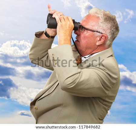 Senior Man Looking Through Binoculars, Outdoor