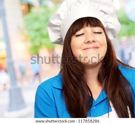 portrait of a young female chef satisfied, outdoor