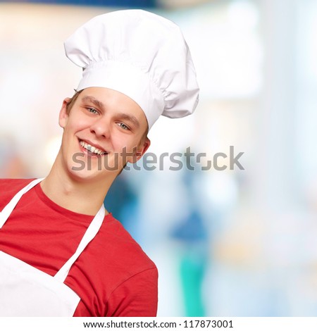portrait of young cook man indoor