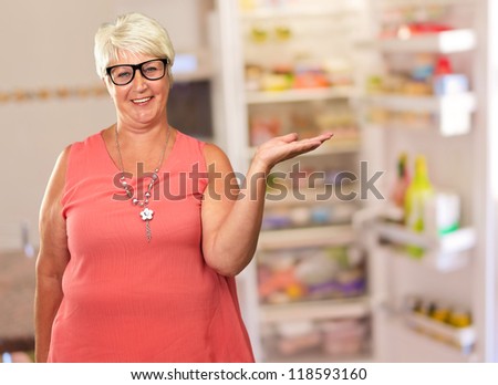 Portrait Of A Senior Woman Presenting, Indoor