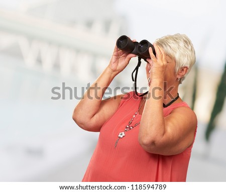 A Senior Woman Looking Through Binoculars, Outdoor