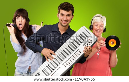Happy Family Listening To Music On Green Background