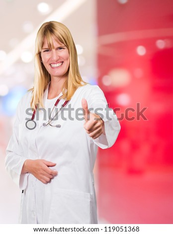 Female Doctor Showing Thumb Up in an office, indoor