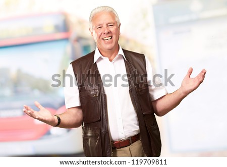 Portrait Of A Senior Man Presenting, Outdoor