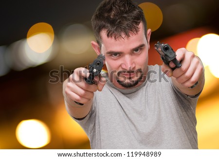 Portrait Of A Man Holding Gun, outdoor