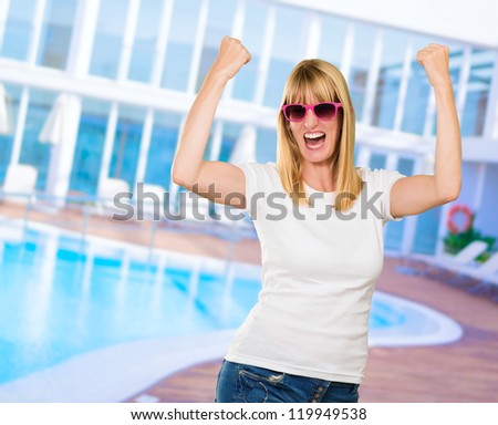 Woman Cheering by the swimming pool
