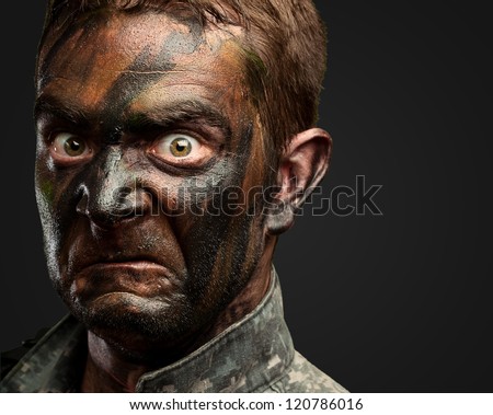 Close Up Of Angry Soldier Face against a black background