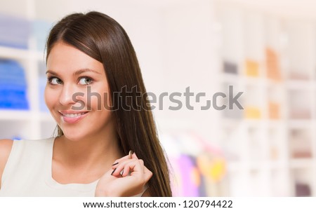 Happy Young Woman Holding Coin And Piggy bank, indoor