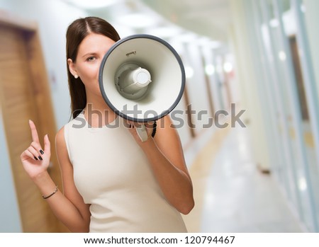 Young Woman Holding Megaphone, indoor