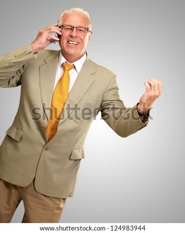 Senior Business Man Talking On Phone Isolated On gray Background