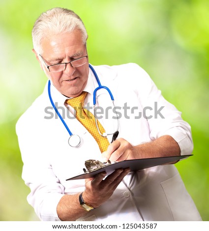 Senior Male Doctor Writing On Clipboard, Outdoor