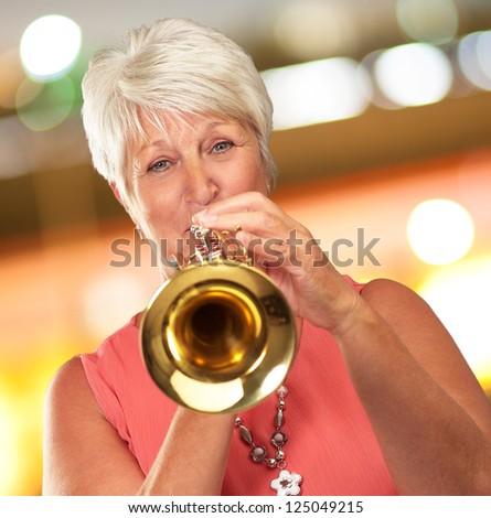 Mature Woman Blowing Her Trumpet, Indoor