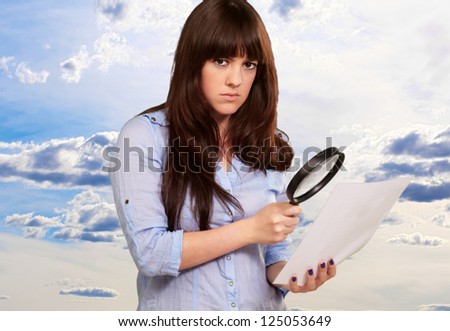 Portrait Of A Girl Holding A Magnifying Glass And Paper, Outdoor