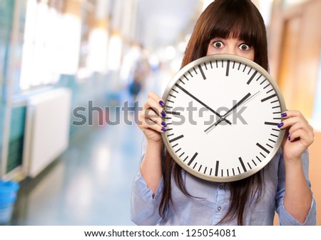 Woman Holding Clock, Indoor