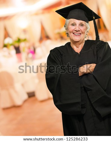 Senior Graduate Woman With Hands Folded, Indoors