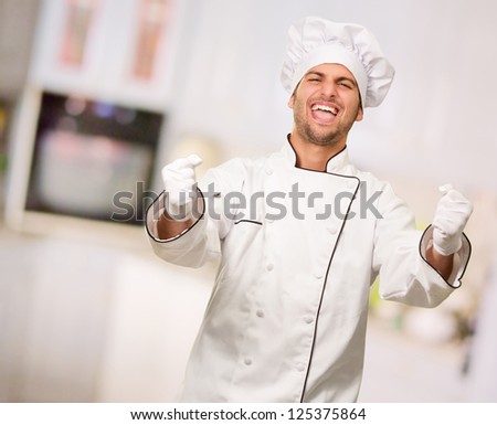 Portrait Of Happy Male Chef, Indoors - stock photo