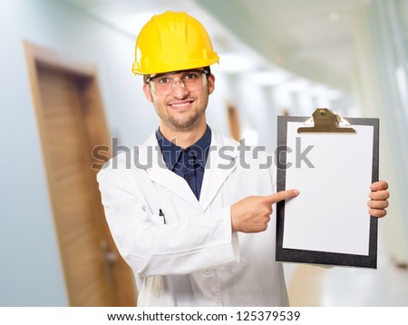 Architect Pointing On Clipboard, Indoor