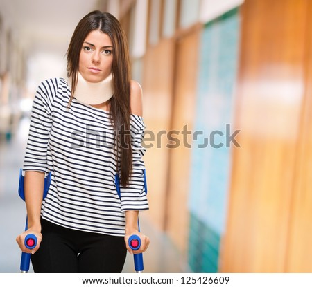 Portrait Of A Young Woman With Crutches, indoor