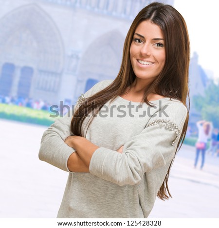 Portrait Of A Young Woman With Arms Folded, outdoor