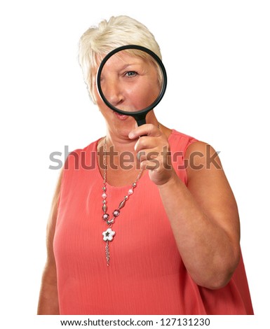 Senior Woman Looking Through A Magnifying Glass On White Background