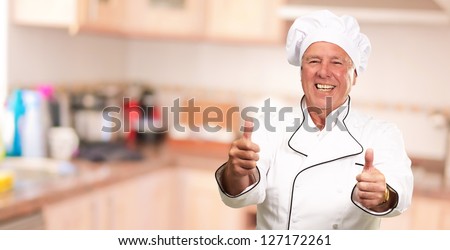 Portrait Of A Chef Cook With Hand Sign, Indoor