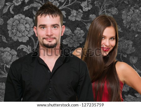 Portrait Of Happy Couple On Wallpaper, Indoors