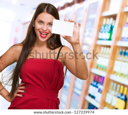 Happy Young Woman Holding Blank Placard, indoor