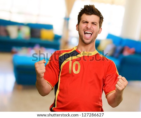 Portrait Of Happy Player, indoors - stock photo