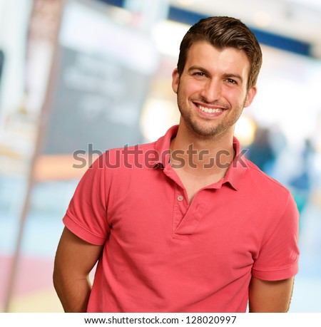 Portrait of young man smiling, background