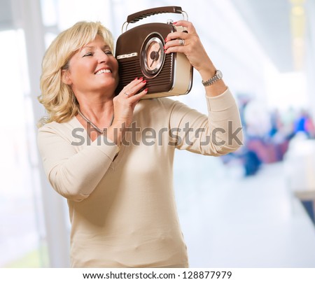 Woman Listening To Music With A Vintage Radio, indoor