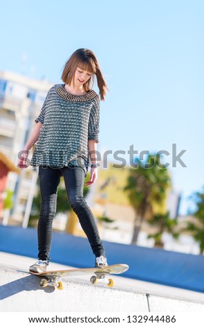Happy Young Woman Skating On Skateboard, Outdoors