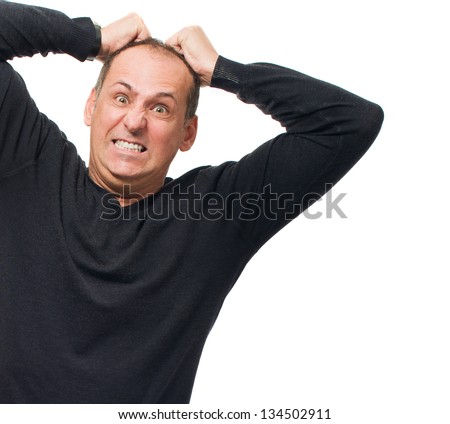 Portrait Of Angry Man Pulling His Hair On White Background