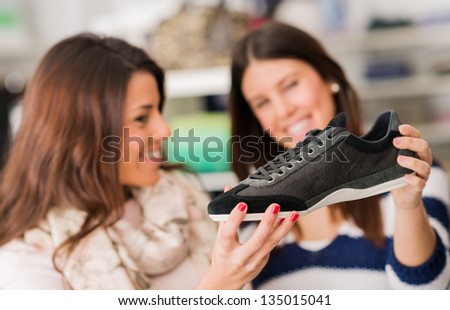 Two Women Buying Shoes, Indoors