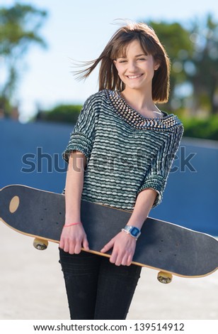 Happy Woman Holding Skateboard, Outdoors